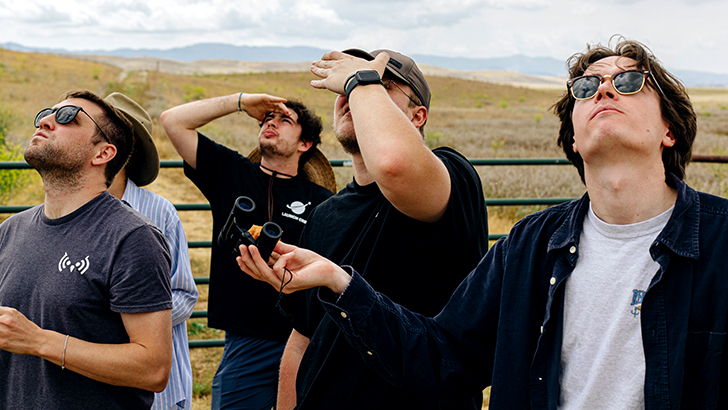 People looking up at the sky